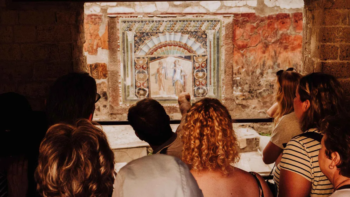 Carbonised wooden beams and intact upper floors at Herculaneum on a Pompeii and Herculaneum tour from Naples, Italy